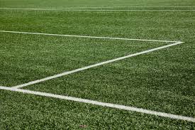 The middle of the field is divided lengthwise by the midfield line. White Lines On Soccer Field By Rene De Haan Grass Soccer