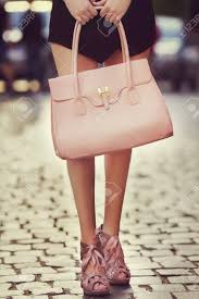 If you are in the business of adding to your already awesome closet, be sure you give your dress collection a good look before you declare yourself done. Elegant Outfit Closeup Of Leather Bag In Hands Of Stylish Woman Fashionable Girl Posing On The Street Female Fashion City Lifestyle Toned Stock Photo Picture And Royalty Free Image Image 63002172