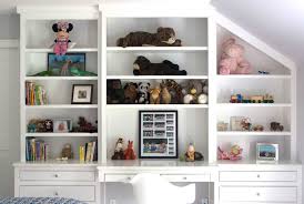 With shelving, you can quickly turn an empty closet or a partially finished one into a perfect organizational space for your child's room. Kids Built In Desk Traditional Girl S Room Sage Design Built In Shelves Living Room Bookshelf Design Built In Desk