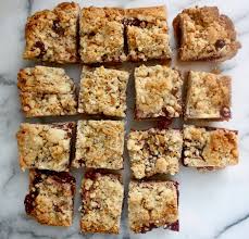 Ina Garten S Famous Raspberry Jam Crumble Bars Raspberry Crumble Bars Truffle Cookies How Sweet Eats