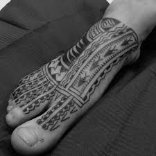 This isn't a simple foot tattoo, but a leg design that spreads on the foot in all its beauty. 40 Tribal Foot Tattoos For Men Manly Design Ideas