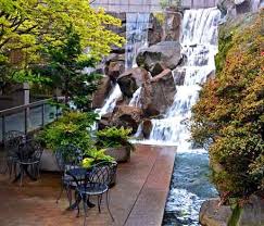 This is asecret spot well worth visitingon a walk through the district and not well advertised amongst tourists. Explore Seattle S Waterfall Garden Park With Dazzling Places Com Garden Park Waterfall Landscape Design
