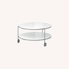 Typically, the top is made of glass while the base or frame can be wood (such as oak) or metal (such as brass, chrome, or iron). Ikea Round Glass And Metal Coffee Table Aptdeco