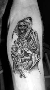29 Of The Spookiest Grim Reaper Tattoos Reaper Tattoo Grim Reaper Tattoo Grim Reaper Tattoo Designs