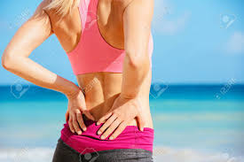 Muscle spasms of the lumbar spine. Back Pain Athletic Fitness Woman Rubbing The Muscles Of Her Stock Photo Picture And Royalty Free Image Image 27391803