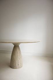 The dining table is made out of travertine that contributes to the sculptur. Peter Draenert 1972 Travertine Dining Table Stone Dining Table Dining Table Travertine