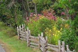 Once in a while i've seen steel t posts driven in at some bucks to help keep them in place in high winds, probably not needed where you are. Inspiration Thursday Farm Fence Rustic Garden Fence Cottage Garden Design Cottage Garden
