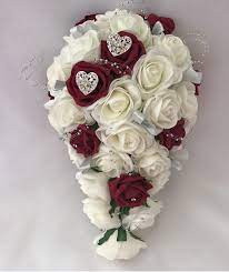 We create stunning handmade wedding bouquets and can offer a bespoke design service free of charge just email us a picture or your ideas and we can this is a selection of our shower bouquets also known as teardrop bouquets where the flowers trail down into a cascade. Artificial Bridal Teardrop Brides Bouquet Silver Hearts