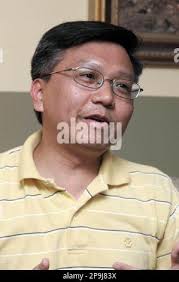 ADVANCE FOR WEEKEND EDITIONS OCT. 11-12 ** Khoan Tran, is seen at his home,  Wednesday, Oct. 1, 2008 in Newtown, Conn. Earlier this year, Tran wrote his  life story out, the