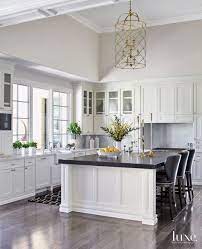 The Classic And Timeless Kitchen Includes Painted Cabinets By R G Custom Crafting With Pol Black Kitchen Countertops Timeless Kitchen White Kitchen Traditional