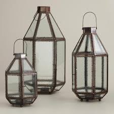 Place these antique silver glass pillar candle holders among your floral display for added radiance and style. Kamali Detailed Trim Tabletop Lanterns Candle Holder