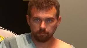 Man charged with assault as murder investigation continues