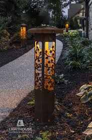 Nightscaping Grove 25 Path Light Along A Walkway Compliments The Landscaping And Leads Guests To The Ba Landscape Lighting Design Led Outdoor Lighting Outdoor