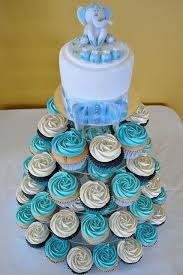 For a boy themed baby shower, chocolate cupcakes with blue frosting and sprinkles, it's a winner. Baby Blue Cupcake Tower Baby Shower Cupcakes For Boy Baby Shower Cupcake Tower Elephant Baby Shower Cake