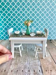 This Beautiful Beach Table And Chairs Has Been Set For A Nautical Dinner Party There Are Two Place Settings Each S Beach Furniture Doll House Wooden Chargers