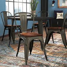 Materials available could include resin, laminate, vinyl, or wooden seats, although metal frames are most common due to their strength and support. Metal Chair With Wood Seat Wayfair