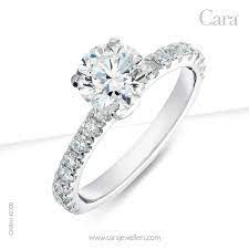 In The Sparkle Of The Round Diamond She Can Perceive Reflections Of Your Love For Her Carajewellers C Engagement Rings Diamond Engagement Rings Engagement