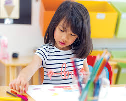 Practice drawing by first tracing the object, then drawing it yourself. Girl Drawing Color Pencils In Kindergarten Classroom Preschool Swan Academy