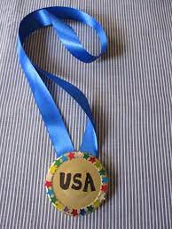 Get into the olympic spirit by making our fun winner's medal. Olympics Craft Diy Olympics Glitter Bracelets Olympic Crafts Kids Olympics Summer Camp Crafts