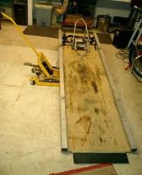 Homemade motorcycle lift constructed from 3/4 plywood, gi pipe, and wooden planks. 7 Diy Motorcycle Lifts Ideas Diy Motorcycle Motorcycle Motorcycle Garage