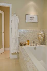 The interior is covered by small subway tiles in a dark brown marble, and 12 x 12 tiles in a sandy brown. Bathroom Travertine Tiles Design Ideas