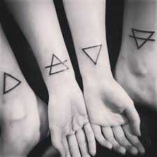 Earth, fire, water and air. Triangular Tattoos That Beautifully Portray The Four Elements Livingly
