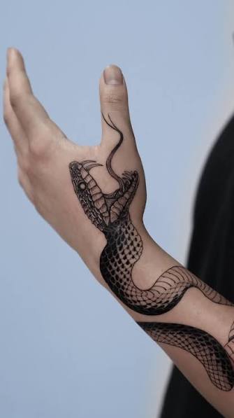 Serpent Hand Tattoo