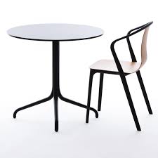 A seat shell and a structural frame. Vitra Belleville Armchair Wood Stuhl Ambientedirect