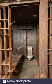 cell in an abandoned prison showing an