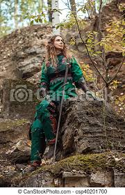 95 armor +8 agility +8 spirit durability 85 / 85 requires level 26. Elf Woman In Green Leather Armor With The Sword Is Sitting On The Stone Canstock