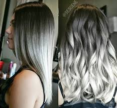 Studio shot of young woman in purple dress with wind in her hair. Black To Grey To White Ombre Hair White Ombre Hair Hair Styles Metallic Hair