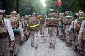 U.S. Marine Corps Gunnery Sgt. Harold Rivera, left,