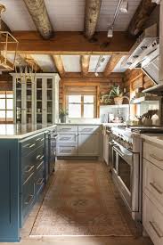 A Modernized Log Cabin Renovation High Street Homes In 2020 Log Home Kitchens Cabin Style Homes Log Cabin Kitchens