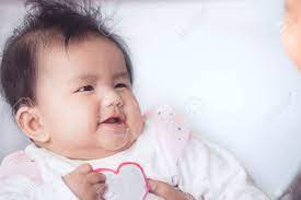 This content is imported from youtube. Smile Cute Asian Baby Girl Is Playing And Looking At Her Parent Stock Photo Picture And Royalty Free Image Image 97491804