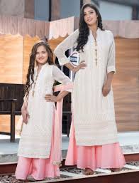 Fascinating curly mother and beautiful trendy daughter in the same outfit posing together after birthday party. White Lucknowi Work Georgette Mother Daughter Matching Palazzo Suit G3 Mdc0017 G3fashion Com