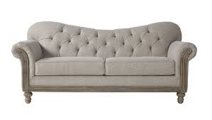 The entertainment center is made from rustic, raw wood with barn style doors. 12 Perfect Farmhouse Sofas For All Budgets