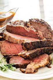 By searing off a few hunks of beef shin or oxtail in a dutch oven, deglazing the drippings with wine and stock, adding some vegetables, then roasting the whole lot along with the prime rib in the same oven to serve alongside that roast dinner. Prime Rib Roast Jo Cooks