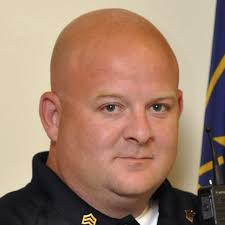 Suspect in Southport police officer slaying shot about 15 times, police say.