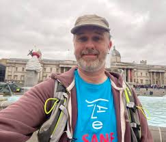 Why is David running a 10K every month for charity?