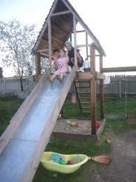 The entrance end of the slide bedway is extended and bent ove. Diy Project Playhouse With Slide Backyard Slide Playhouse With Slide Diy Playground
