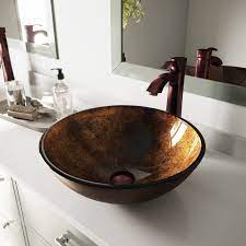 We have had oil rubbed bronze finished faucets throughout our victorian home for more than 11 years. Vigo Russet Glass Vessel Bathroom Sink Set With Otis Vessel Faucet In Oil Rubbed Bronze