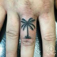 Tiny Palm Tree Tattoo On A Finger By Rebecca G 12ozstudios Team12oz Tattoos Tattooartist Palmtre Finger Tattoos Ideas Tattoo Palm Palm Tree Finger Tattoo