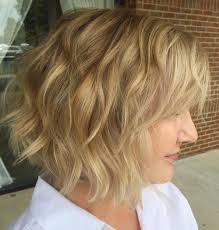 Short, wavy hair can easily be manipulated into straight or curly hairstyles. 80 Best Hairstyles For Women Over 50 To Look Younger In 2020