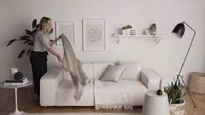 Next, fold the length of the throw blanket in half. How To Style Your Living Space With Cushions And Throws Youtube