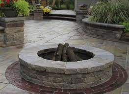 My plan is to stack rings of concrete pavers, glue it together with landscape adhesive or mortar, then dump a couple of inches of sand/gravel at the bottom. Brick Paver Fire Pit Design And Installation Brick Paving Company Near Me