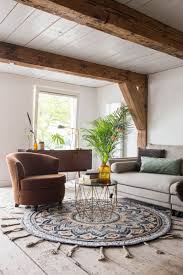 How To Choose The Perfect Rug For Your Home In 2020 Rectangular Living Rooms Rugs In Living Room Living Room Decor Rustic
