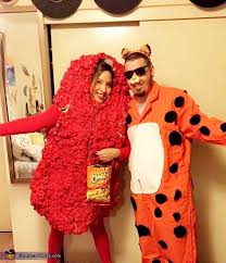 The big cat is yellow with distinctive black spot markings, which cover most of the body. Chester The Cheetah And His Hot Cheeto Costume