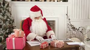 Twerking santa claus, shaking hips singing dancing christmas santa claus toys wiggle hip blowing saxophone santa claus xmas electric dolls gift. Busy Santa Claus Checking Christmas Letters Sitting At His Table By Fancystudio