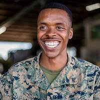 Private First Class Jassett Jones uses a buccal (cheek)