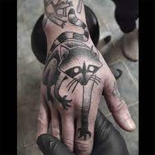 Professional tattoo & body piercing Coon Tattoo On Hand Best Tattoo Ideas Gallery